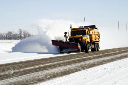 snow plow clearing a road
